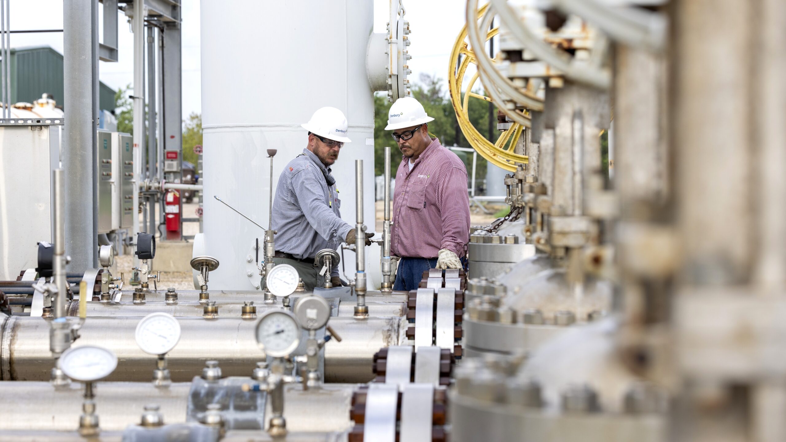 Denbury workers at an operations site.