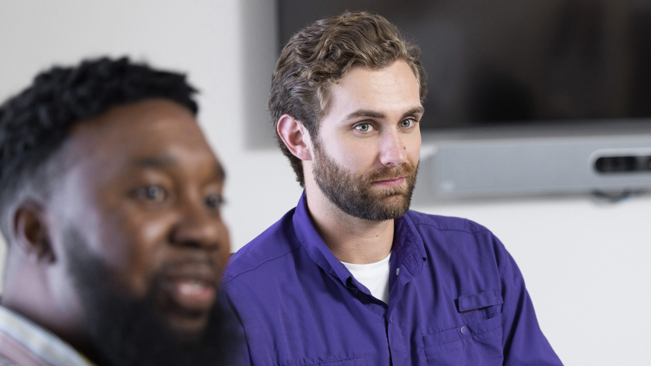 Two people listening.